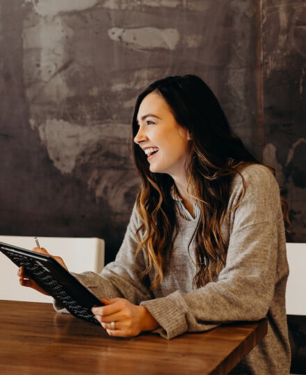 girl smiling in a work meeting