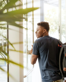 Student walking out doors